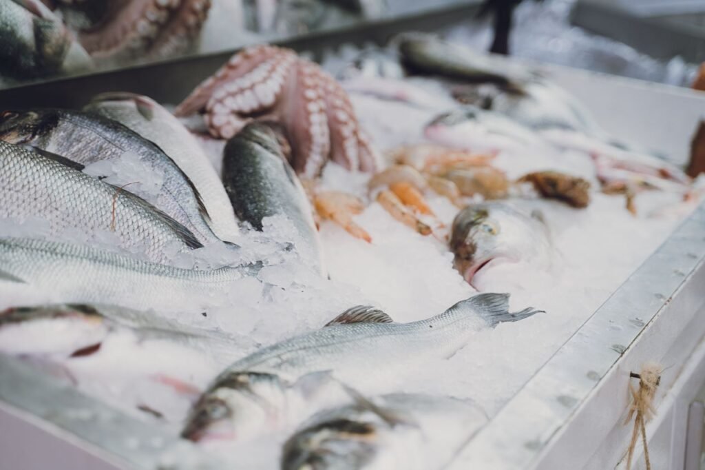Raw fish and seafood on ice at a bustling Turkish fish market. Perfect for culinary and travel themes.